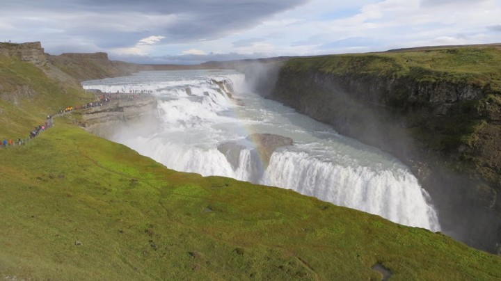 When the sun is shining, rainbows form in the mist of the waterfall.
