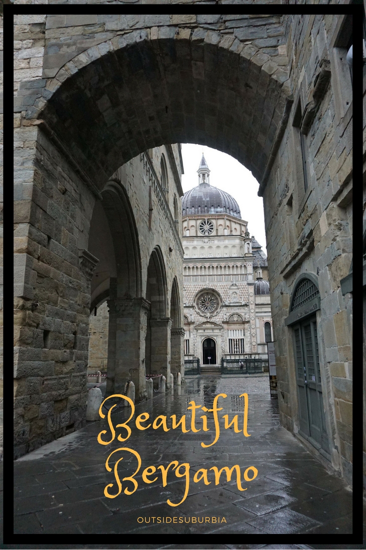 The beautiful old city of Bergamo called the Città Alta sits high on the hill overlooking the modern city and is a quick drive from Milan.  Here is how to spend a day in Bergamo, Italy. #Italy #Bergamo #OutsideSuburbia #DayTripsFromMilan #BergamoInADay #WhattoseeinBergamo