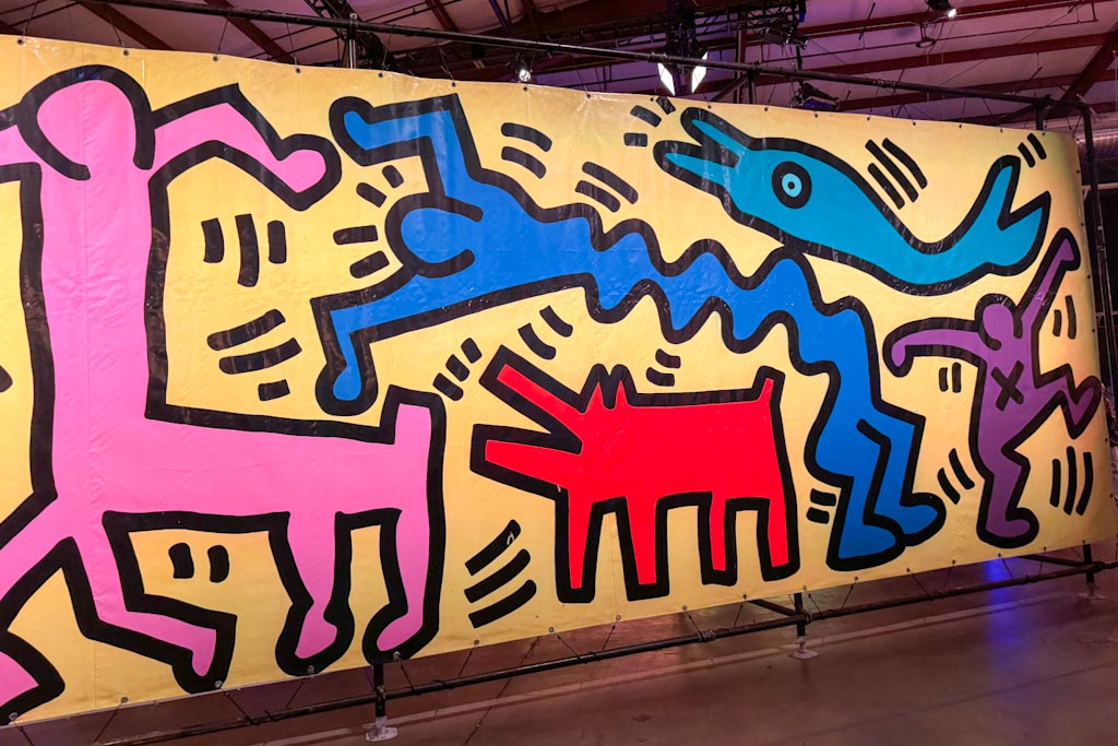 Keith Haring's iconic line drawing appeared on large tarps in the amusement park of Luna Luna